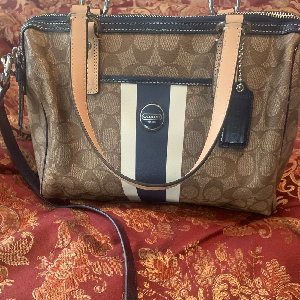 Coach signature bag with baby blue trim and shoulder strap